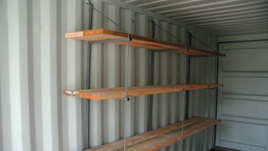 Removable shelving system for shipping containers for rent