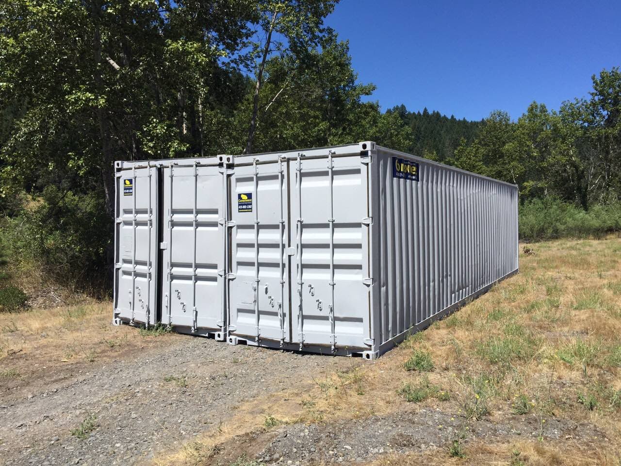 Shipping container joint together side by side on a field grey
