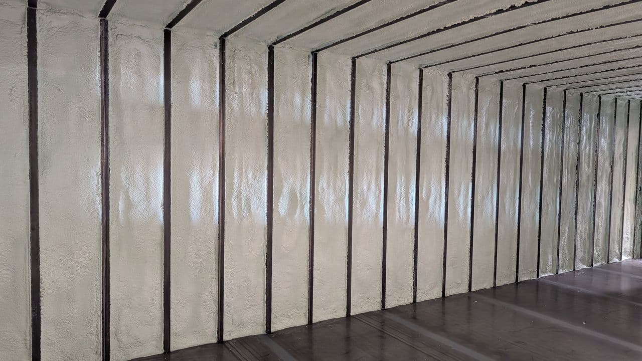 Spray foam insulation of shipping container
