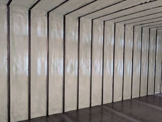 Spray foam insulation of shipping container