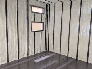 Spray foam insulation of shipping container