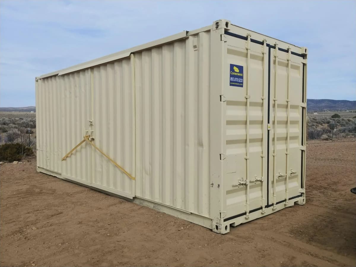 View of a storage container with its barn doors locked and secured with straps