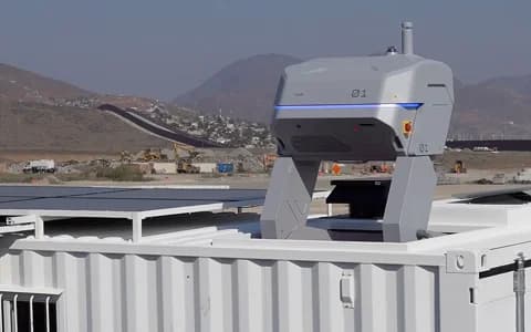 Container with equipment mounted on top in a desert setting