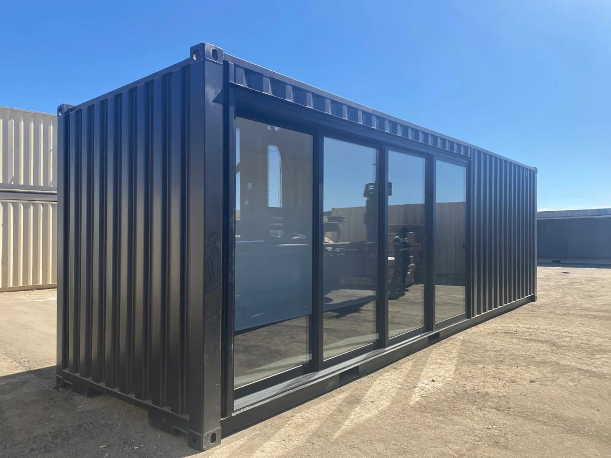 30ft matte black shipping container storefront with glass sliding doors