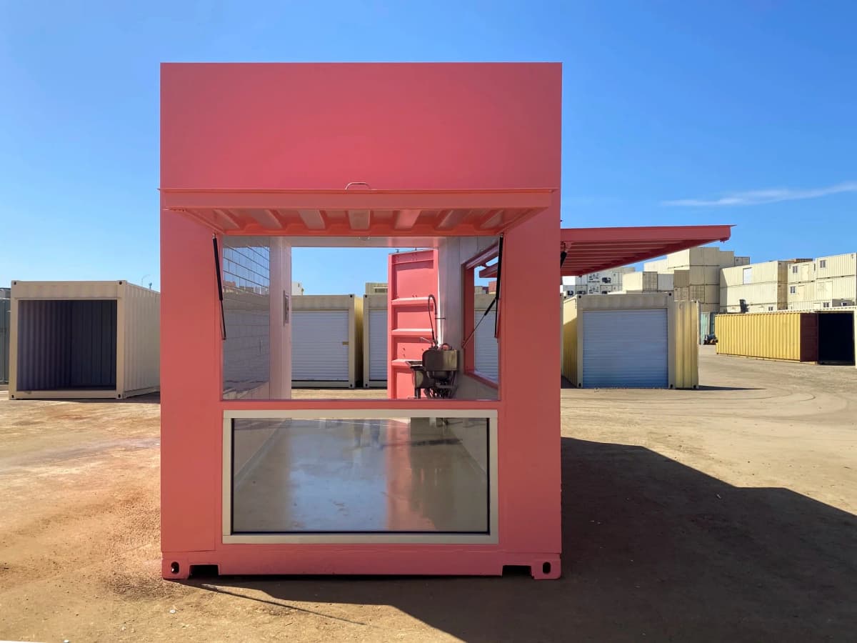 Custom shipping container cafe interior with sink, lighting, and service-ready layout