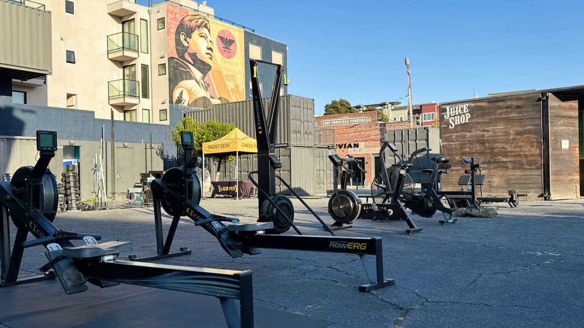LuxFit container gym training area with fitness equipment in an open-air San Francisco plaza