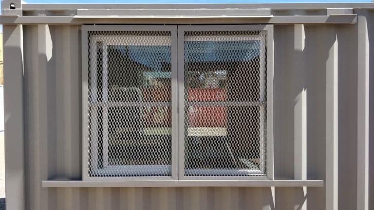 Barn door window security for storage container for sale