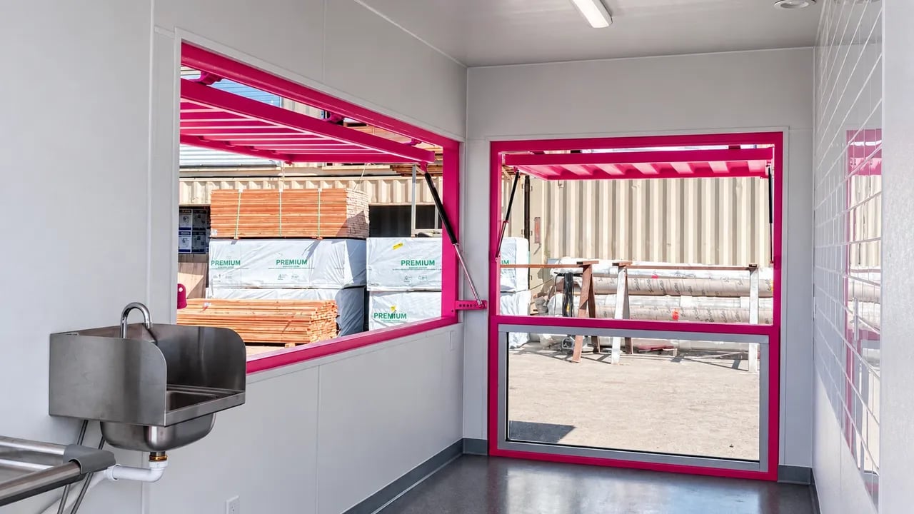 Pink 20ft container modified into the cafe interior