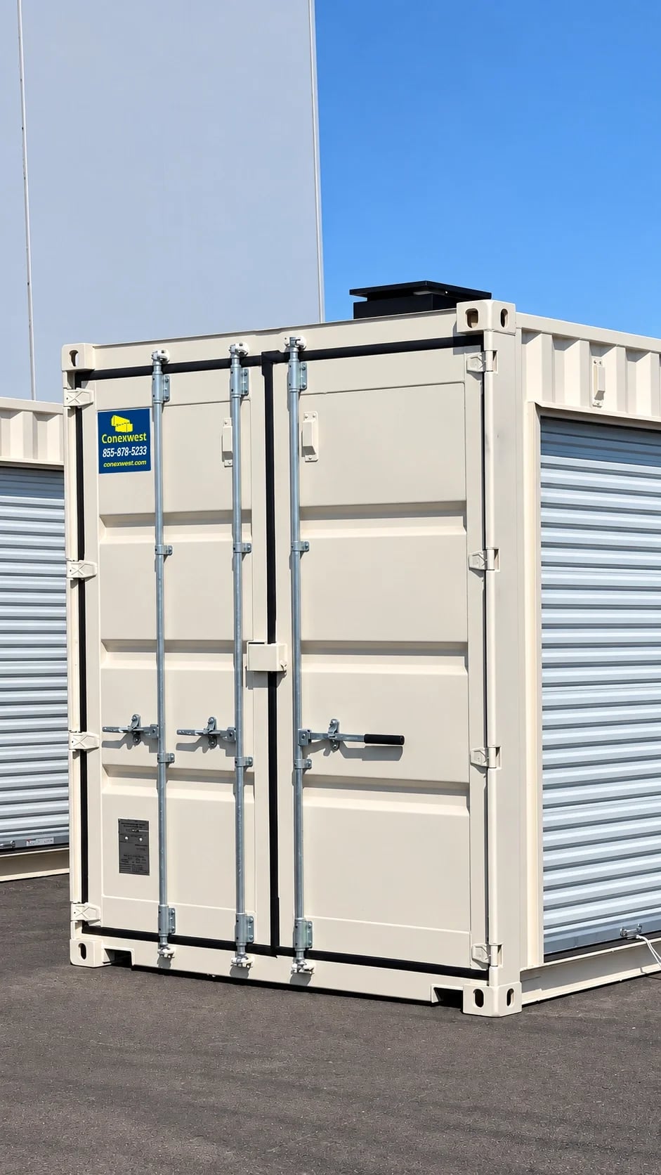 white shipping container with roll up doors outside