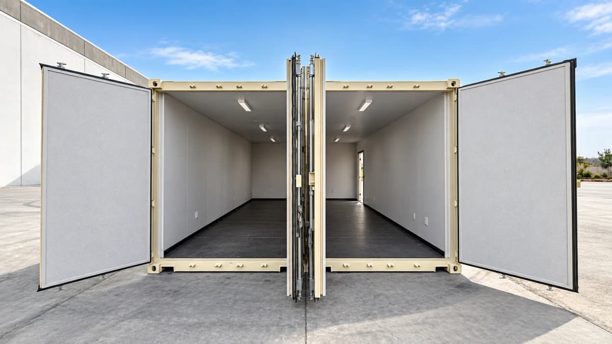 Two 40ft high cube office containers positioned together with open doors showing finished insulated interiors