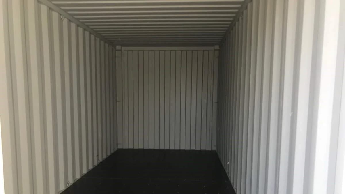 Interior view of a 40-foot storage container with the corrugated Corten steel walls visible