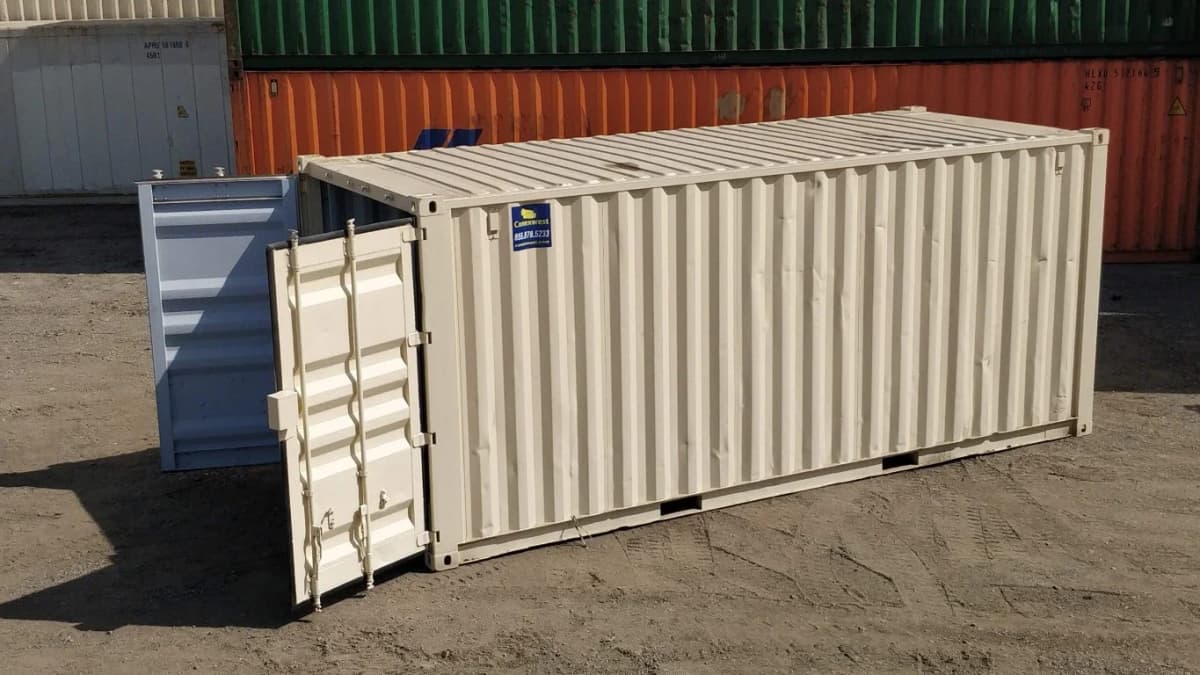 A 24-foot Conexwest container with its doors open in a container storage yard