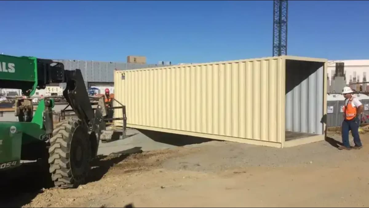 Transporting a shipping container on a site