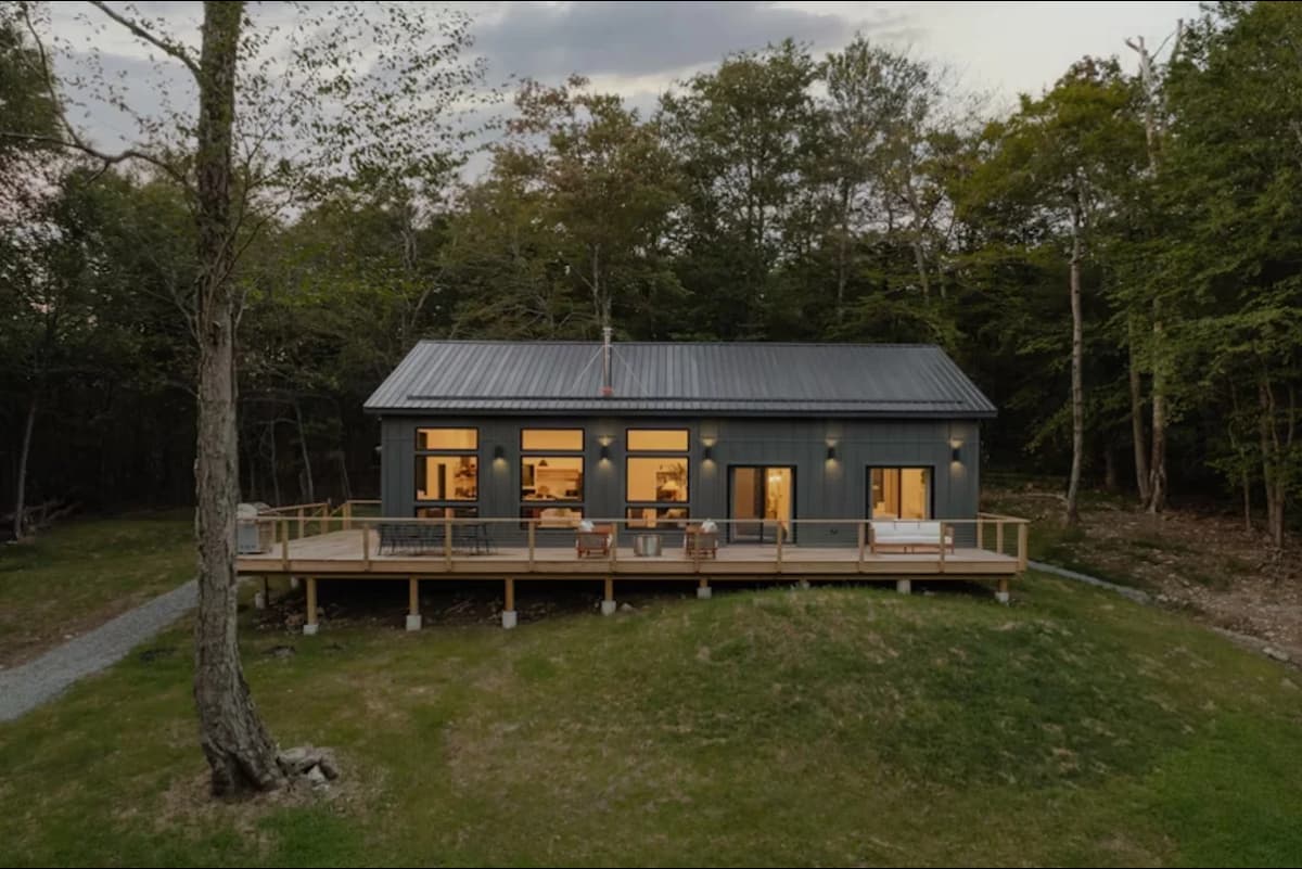 A container home in the forest.