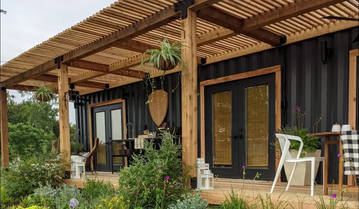 A shipping container home with porch