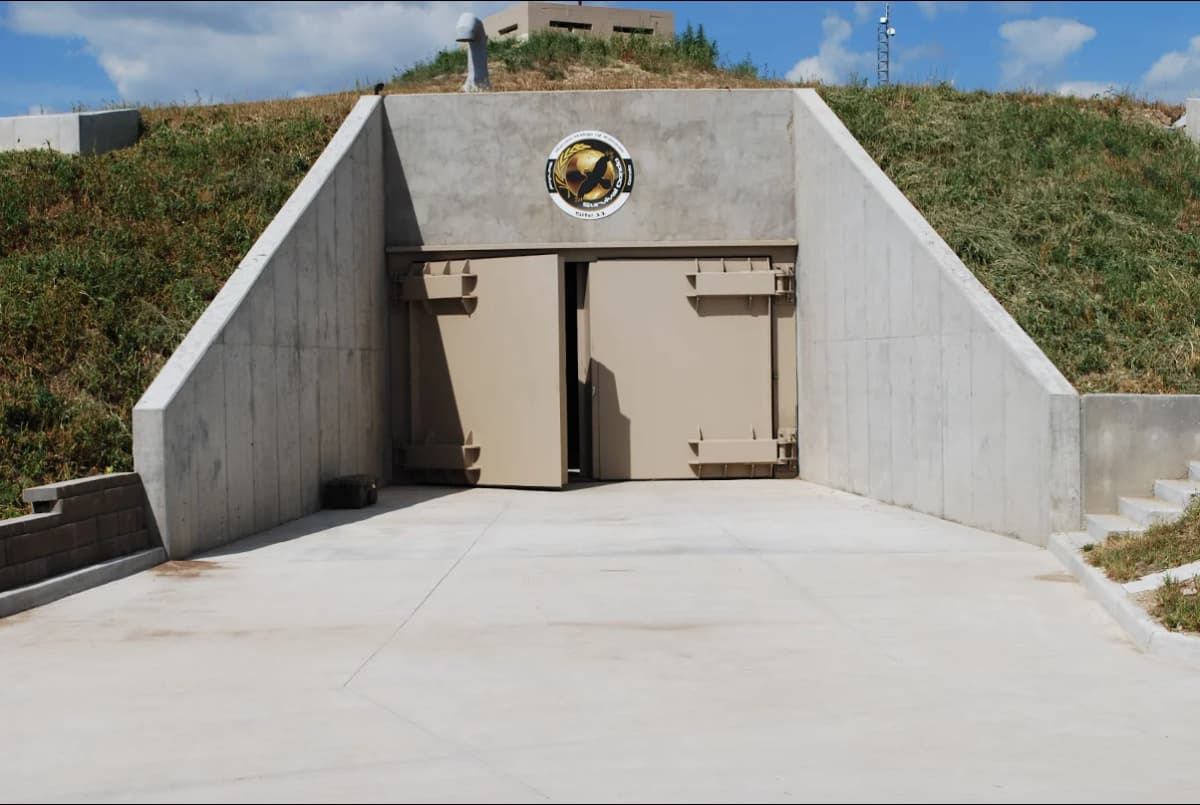 An above-ground fortified bunker with concrete barriers.
