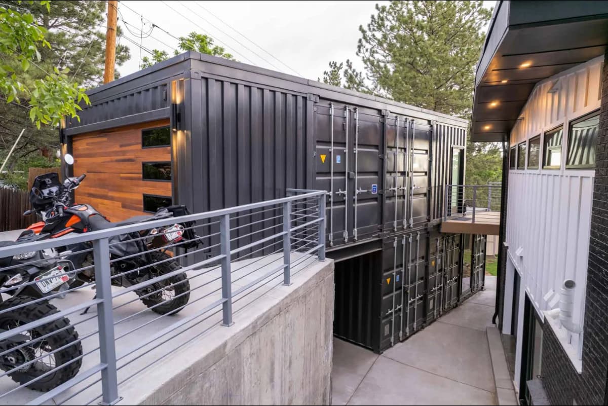 An image of a shipping container garage with a loft