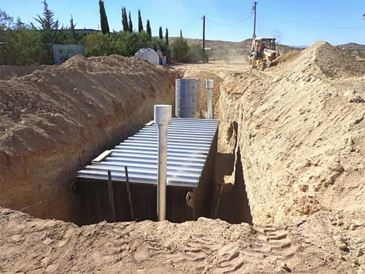 Underground shipping container project with excavation and drainage planning