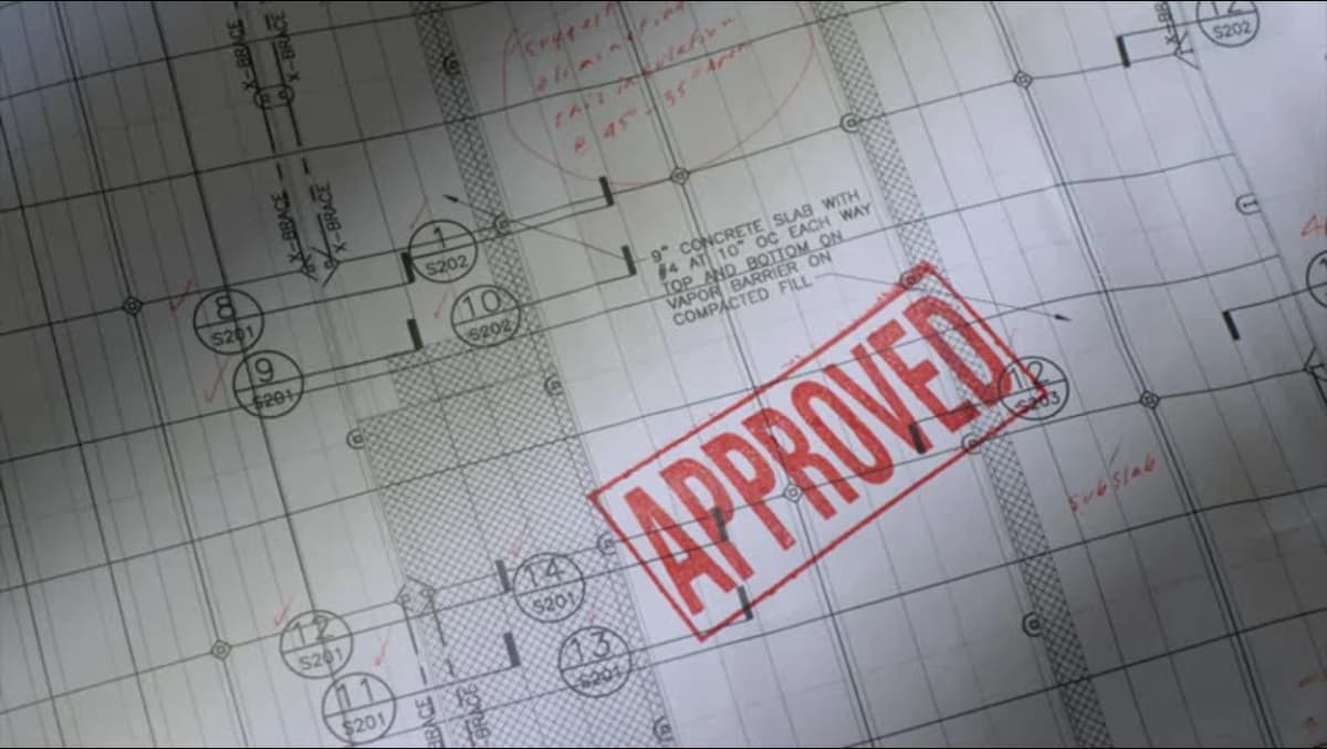 Architectural blueprint with red "APPROVED" stamp overlay.