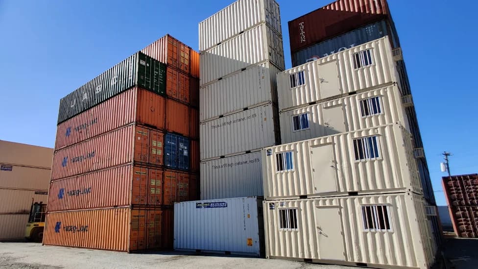 Conexwest shipping container inventory in an outdoor yard.