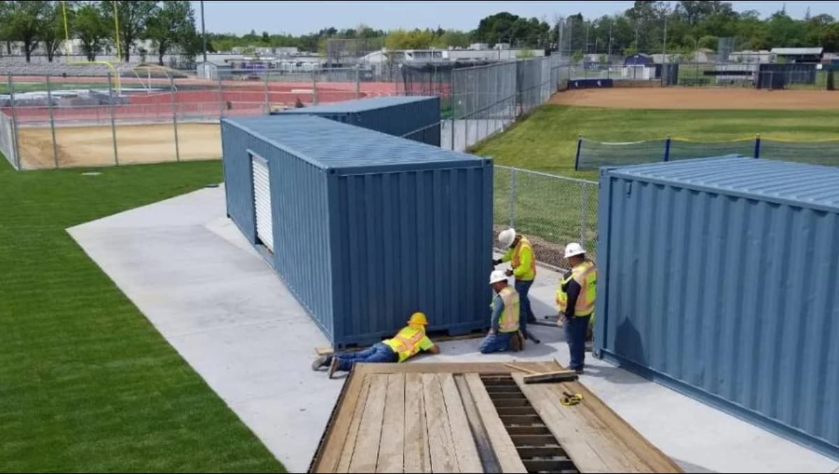 Conexwest team inspecting a modified container structure