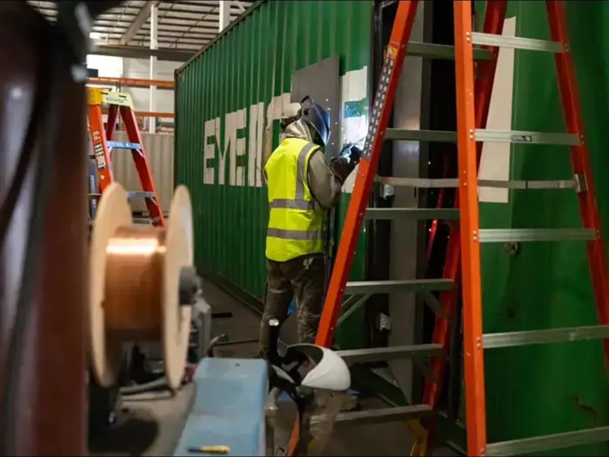 Conexwest team modifying a container.