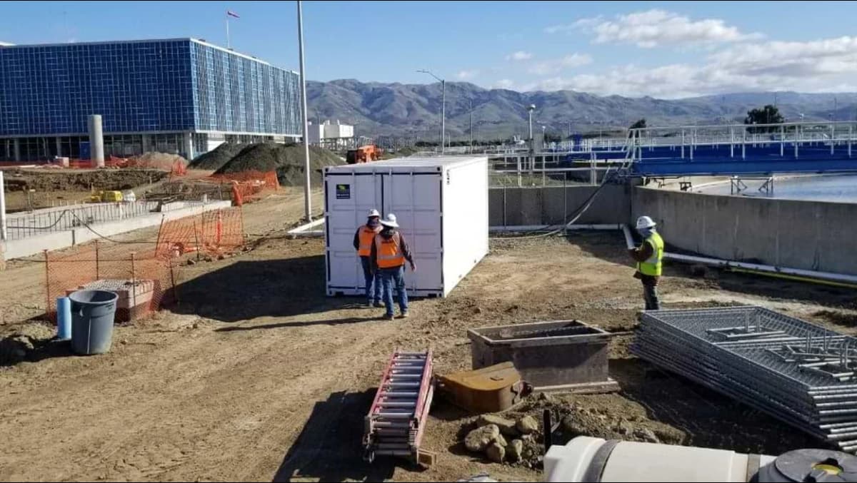 Conexwest team working on shipping containers.