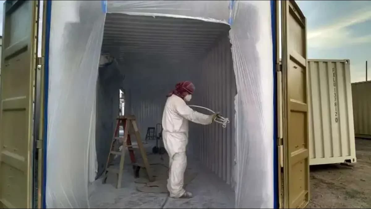 Conexwet team painting a container.