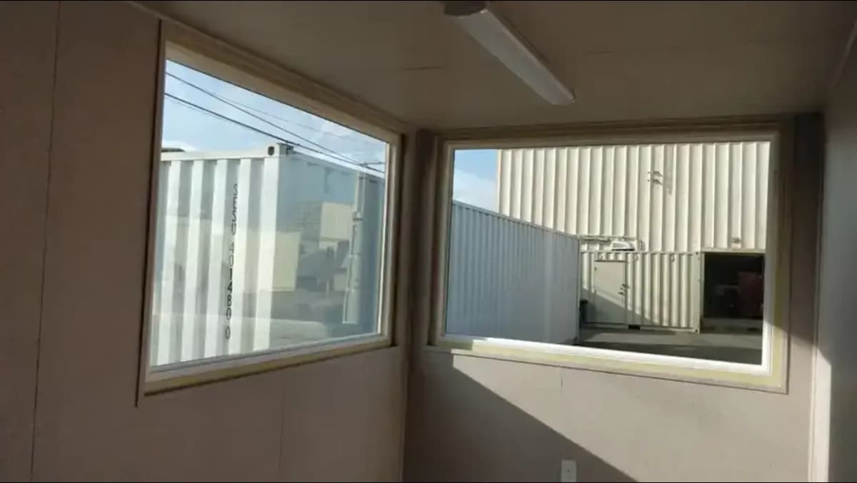 Double-pane picture window for shipping containers.
