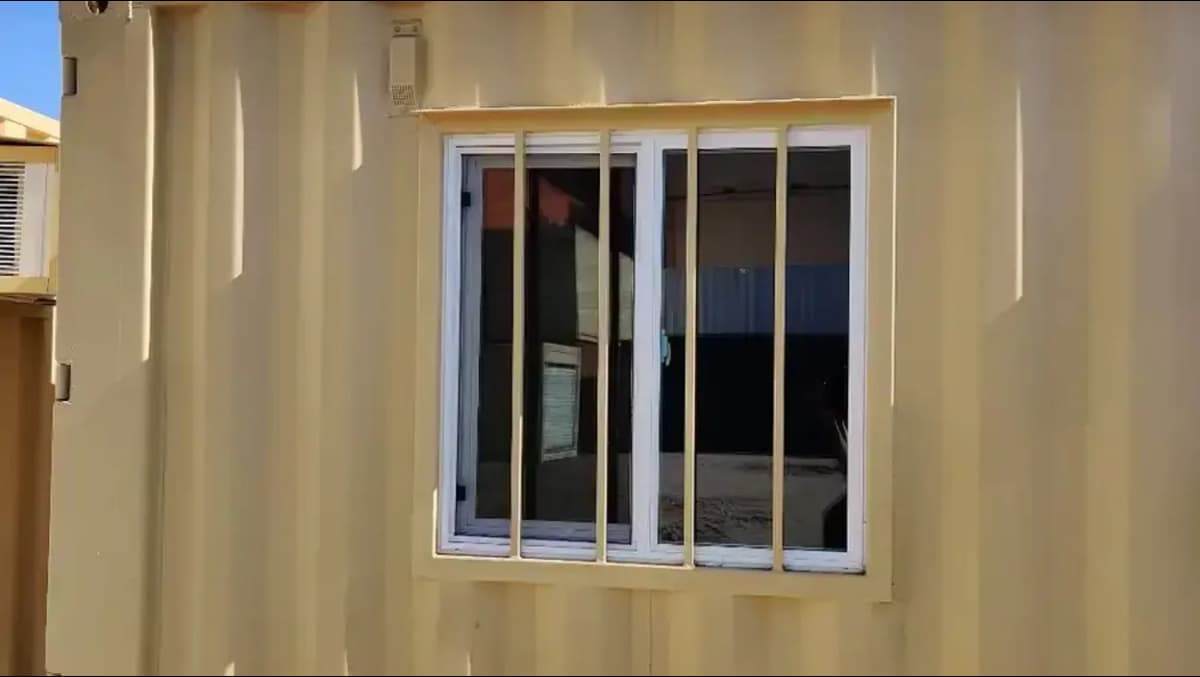 Double-pane sliding windows for shipping containers.