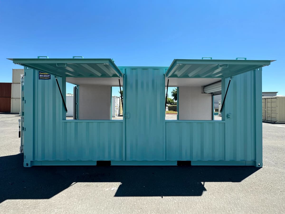 Finished custom shipping container structure with exterior awnings