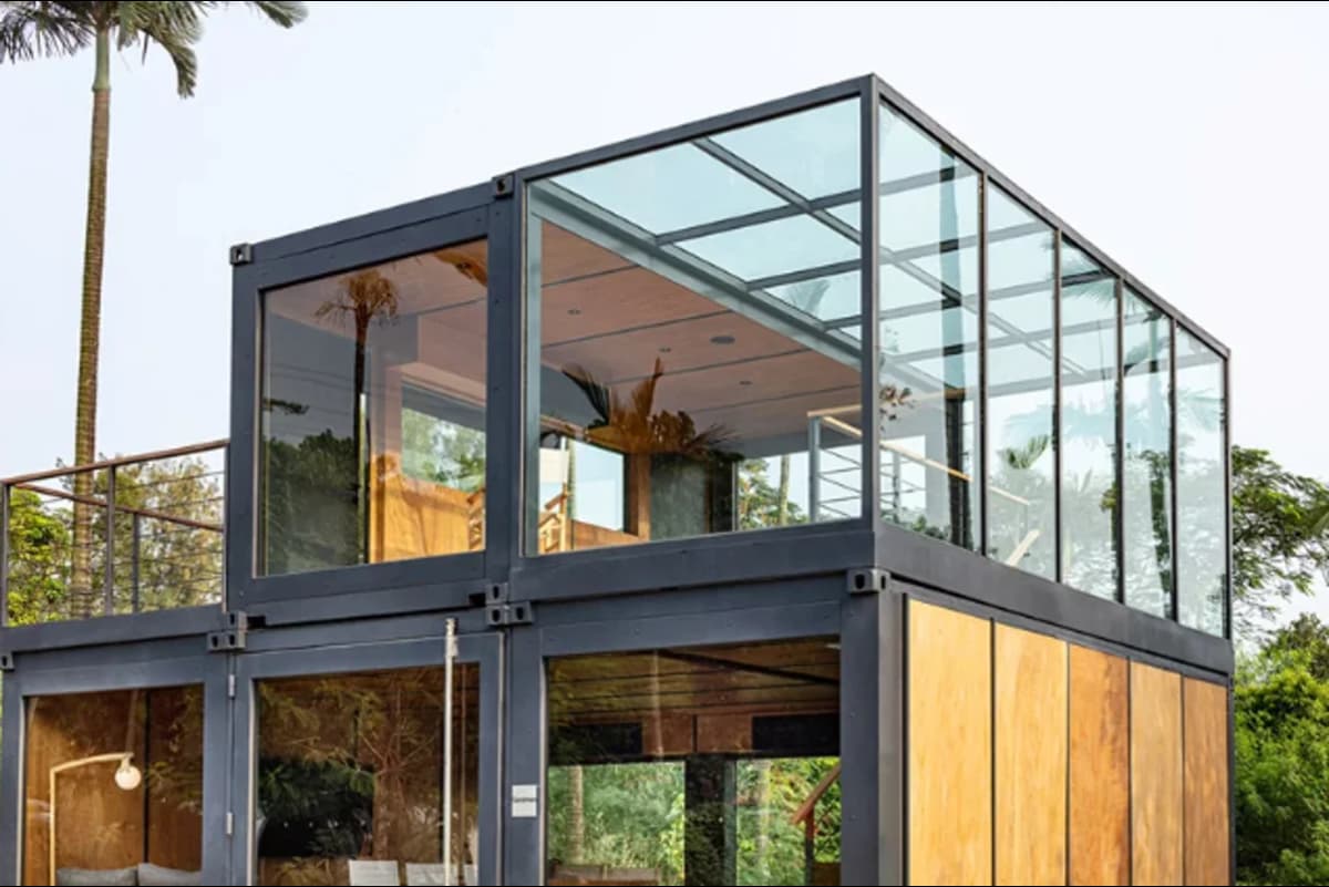 Image of shipping container structure with glass walls.