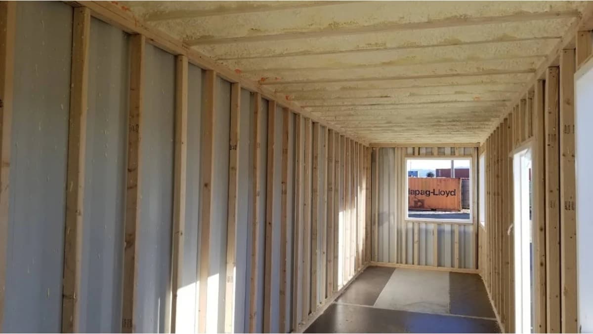 Interior construction view of a shipping container.