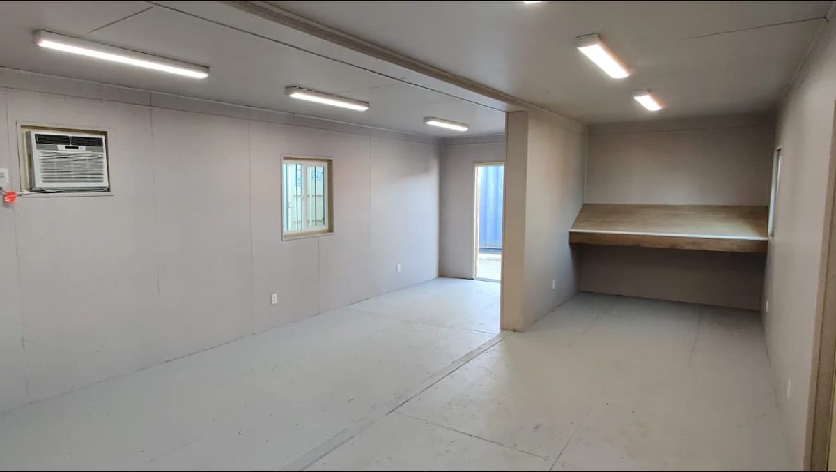 Interior finishes of a shipping container with lighting