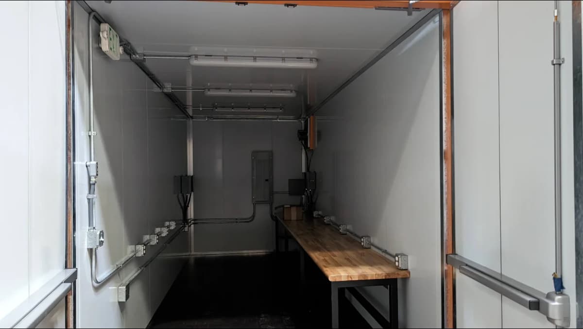 Interior of a modified container showing some electrical modifications.