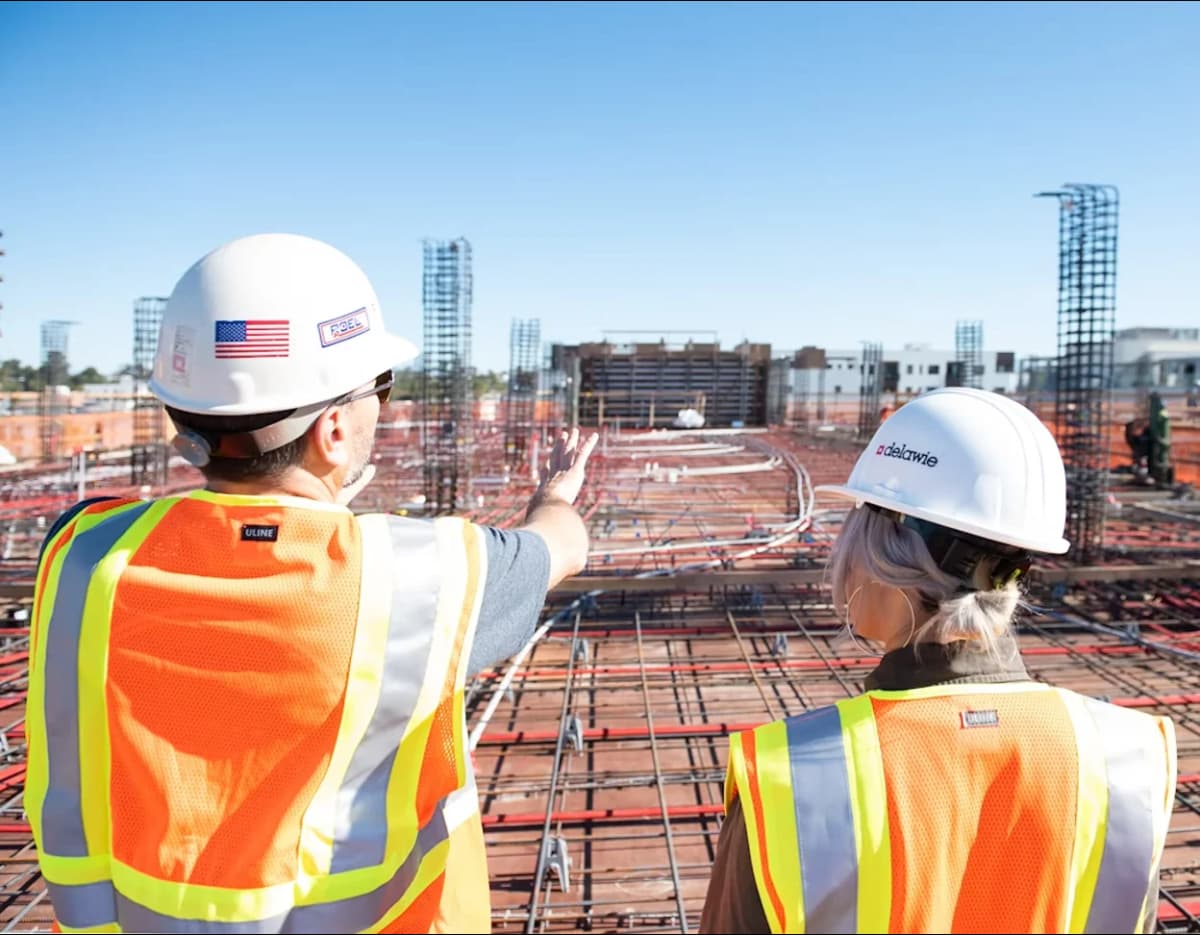 Two building inspectors reviewing construction