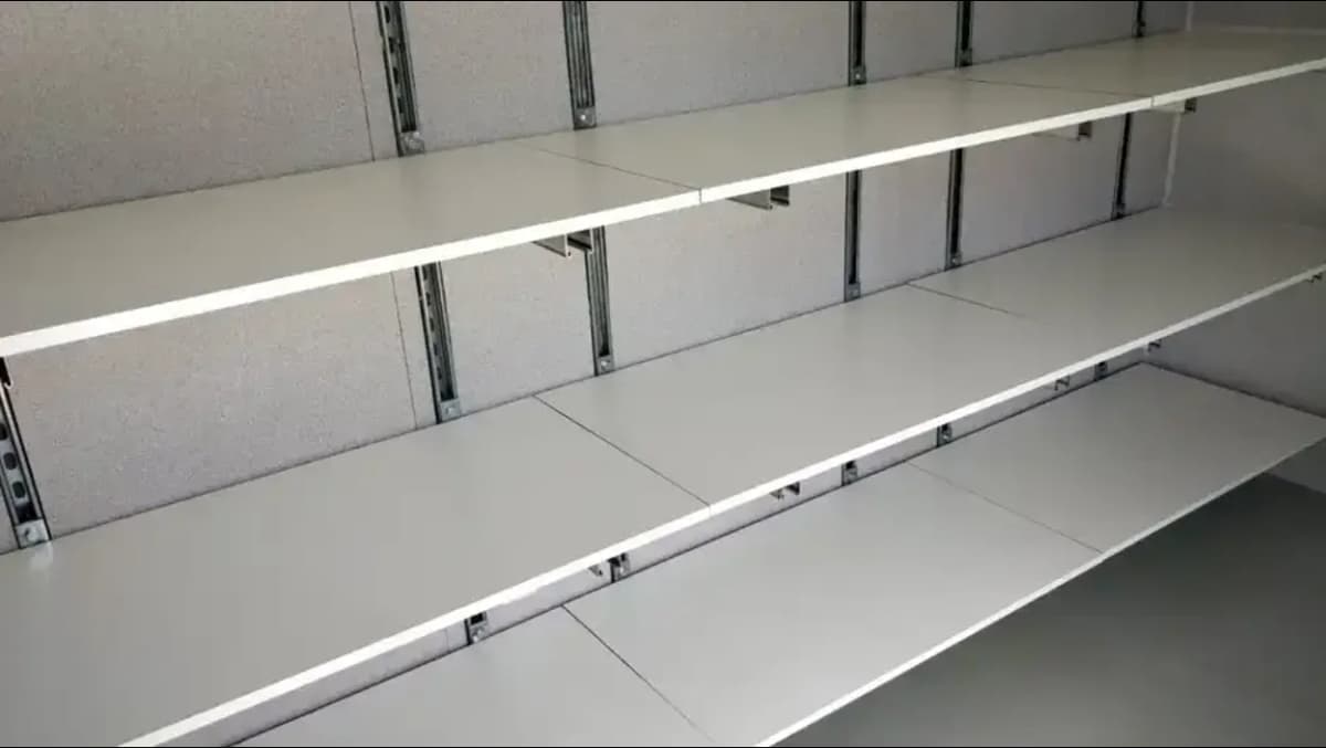 Unistrut adjustable shelving for shipping containers.
