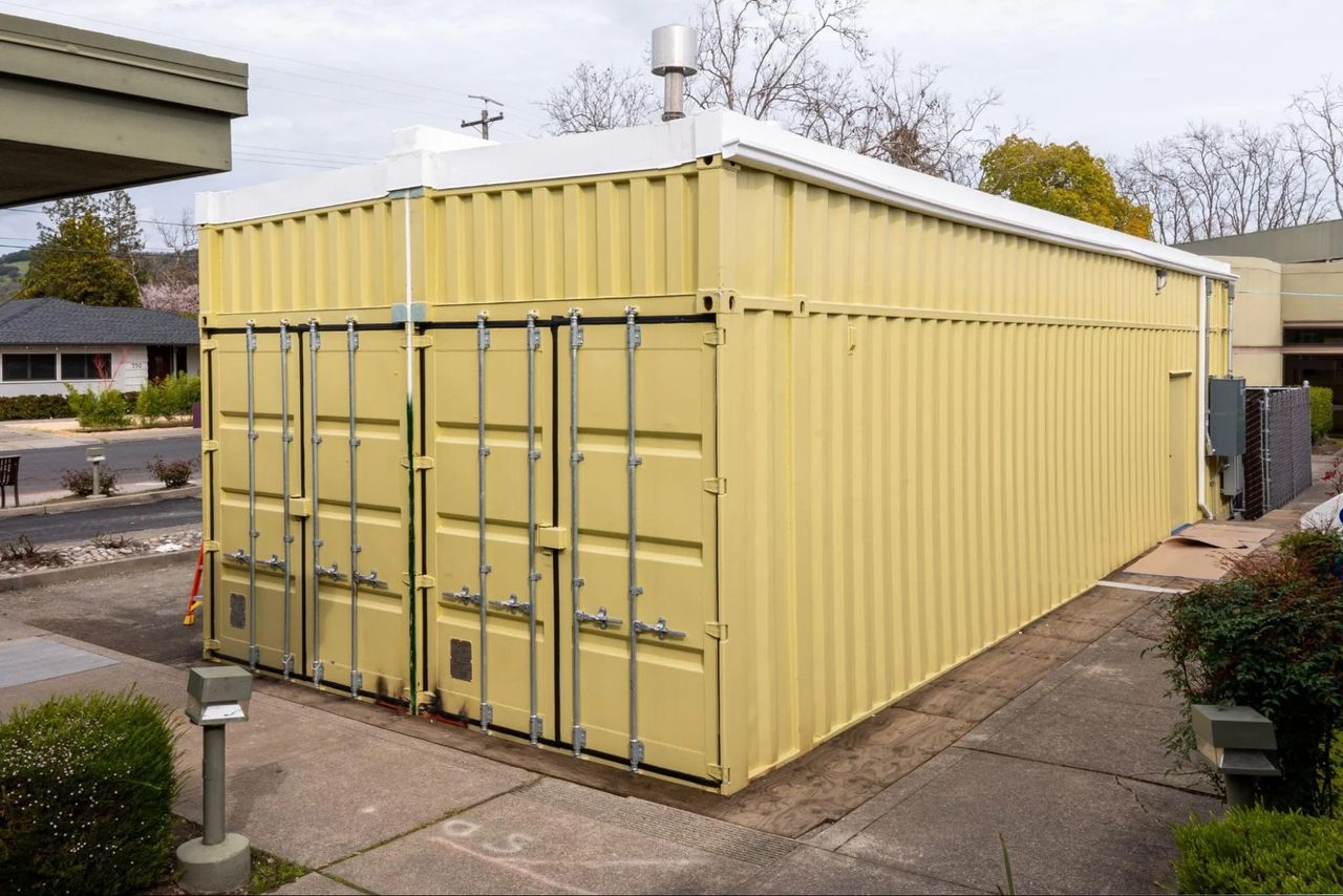 Conjoined shipping containers prepared for MRI installation