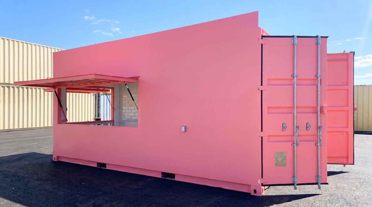 Pink shipping container storefront with open service window