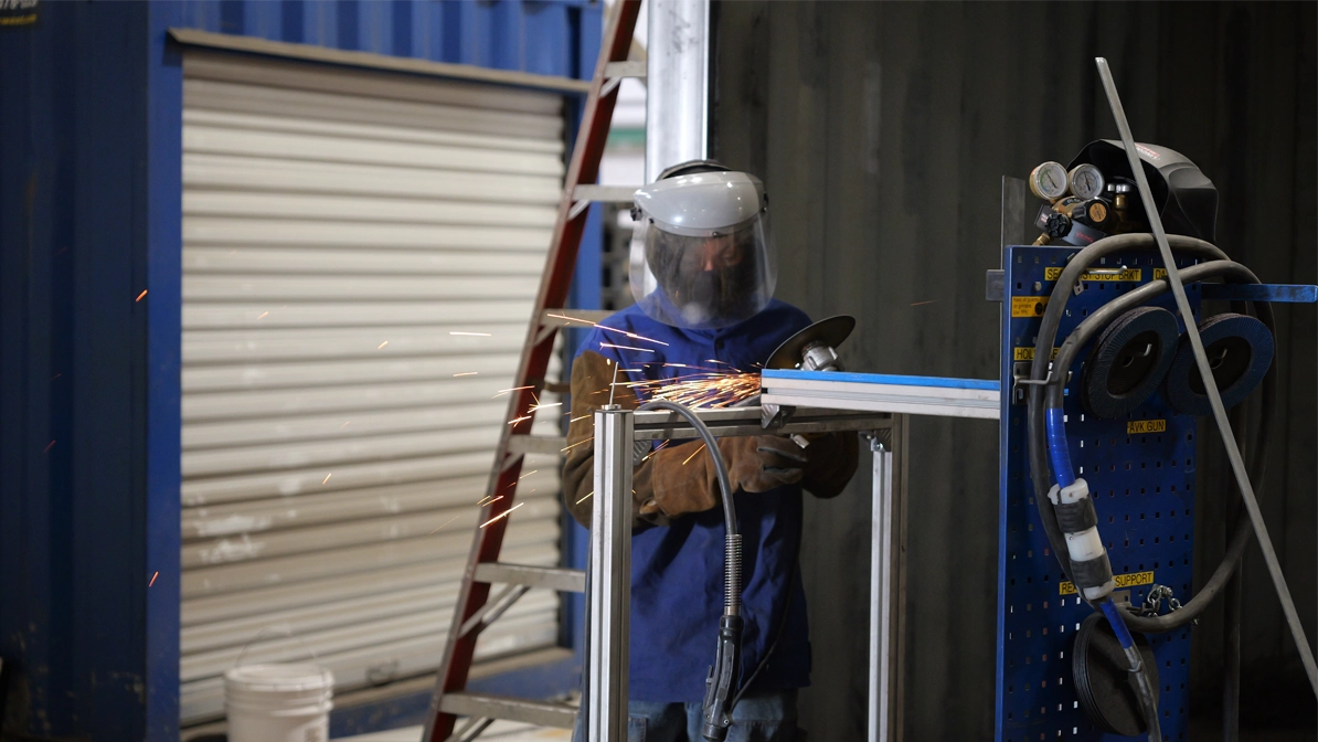 Worker installing roll-up door