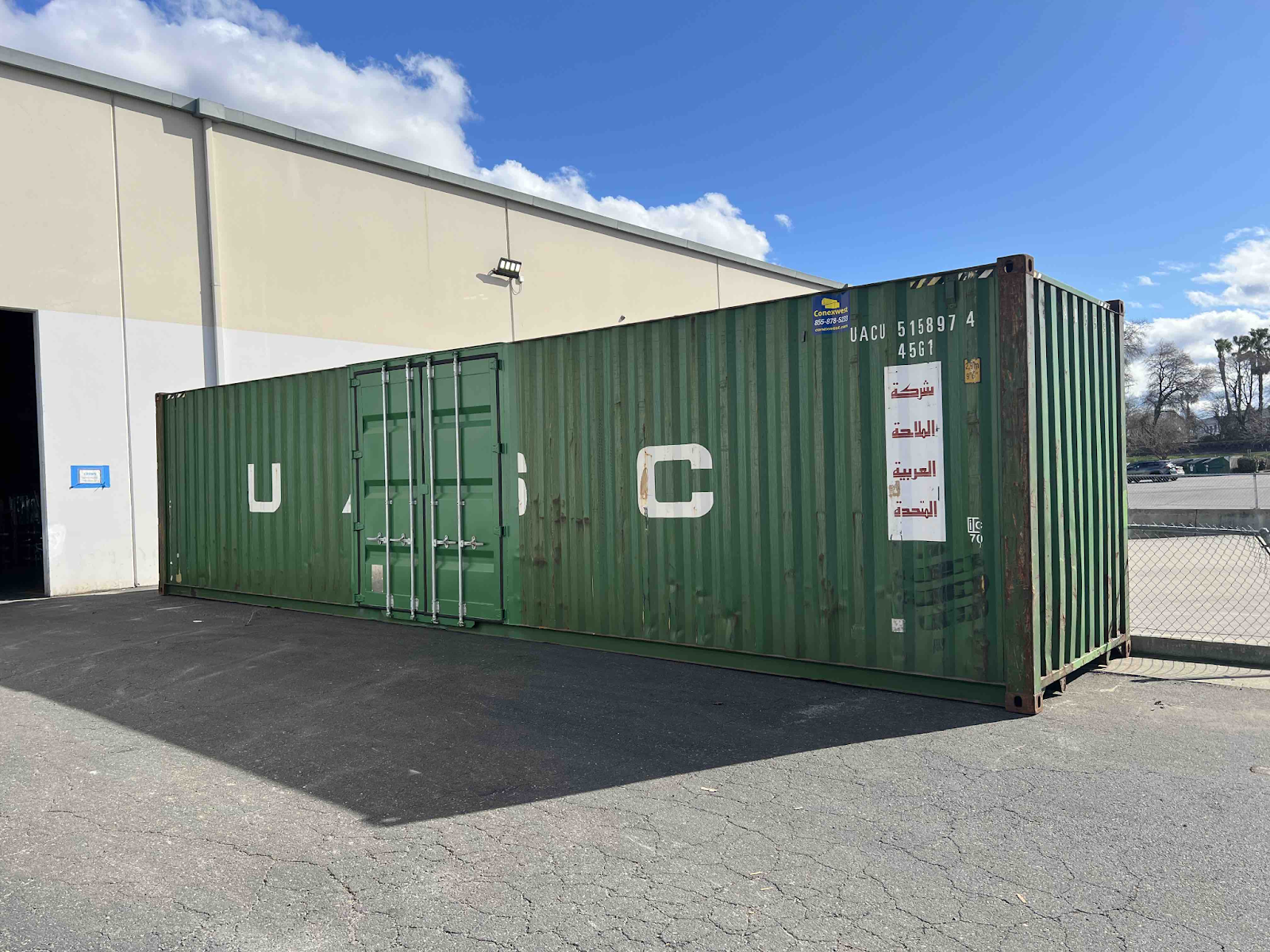 A green container with dual cargo doors