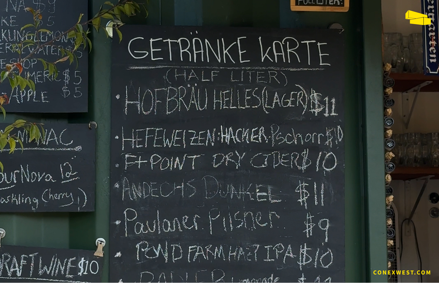 Detailed view of Biergarten’s drink menu displayed on the container wall