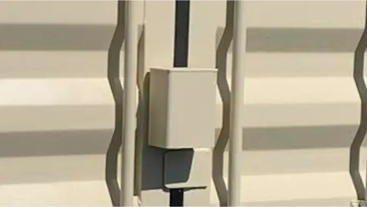 High-security lockbox installed on a shipping container door.