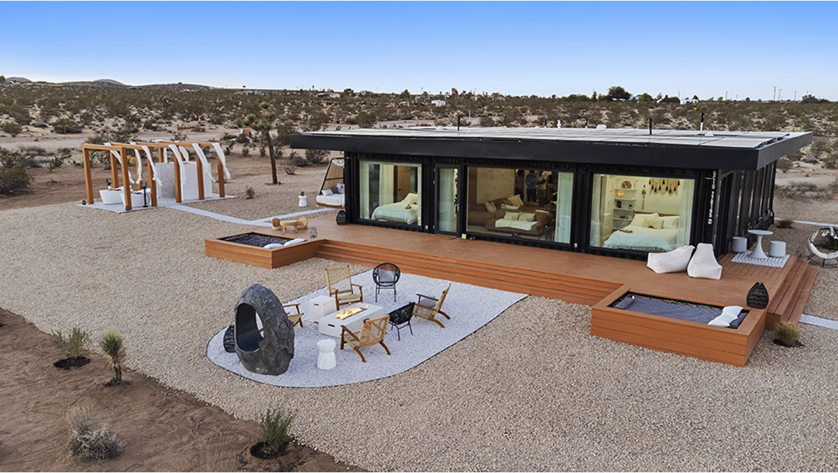 A shipping container home in a desert environment.