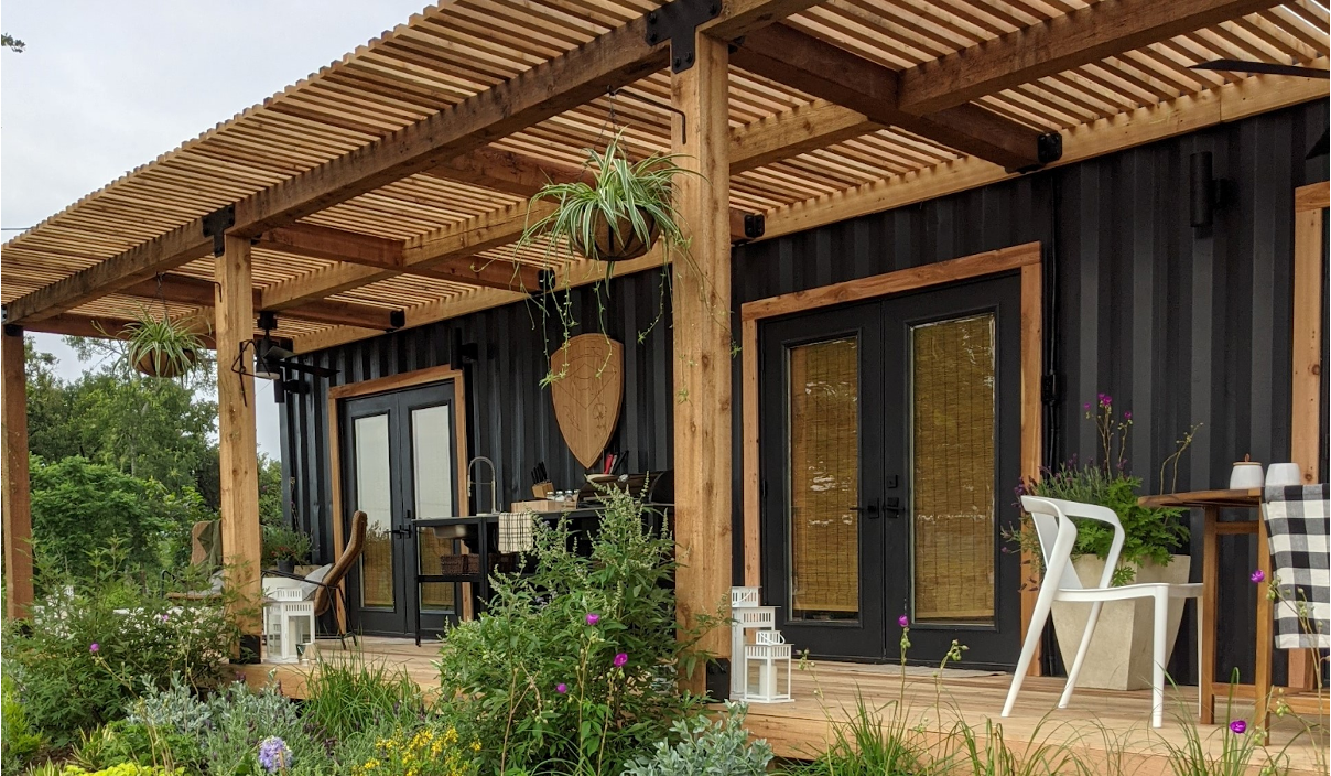 A shipping container home with porch