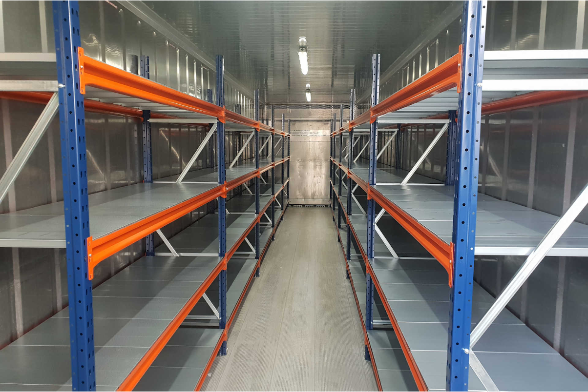 A shipping container with well constructed shelves. 