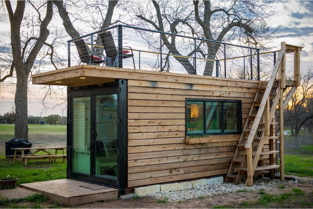 A shipping container with wood siding. 