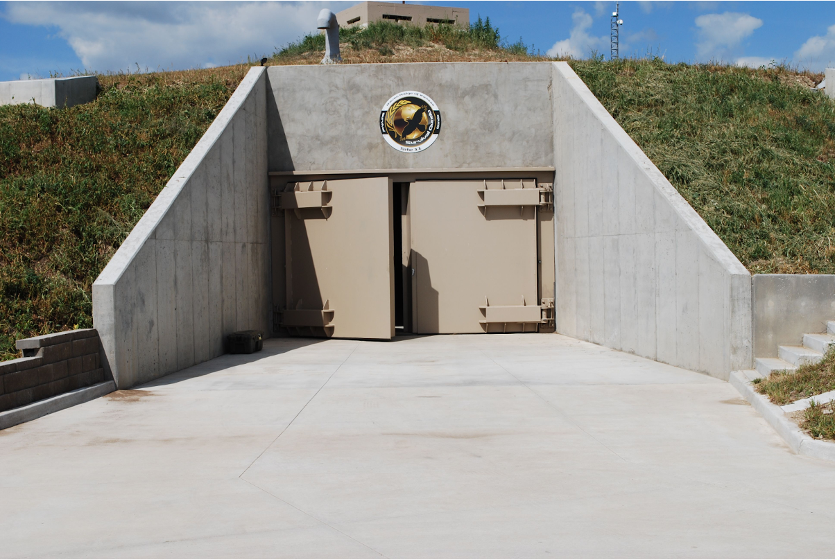 An above-ground fortified bunker with concrete barriers. 