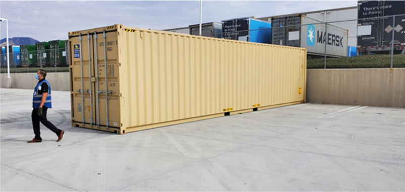 Beige 40-ft shipping container placed in a lot, used for storage or container projects.