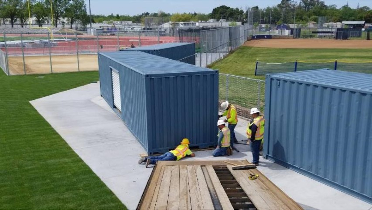Conexwest team inspecting a modified container structure